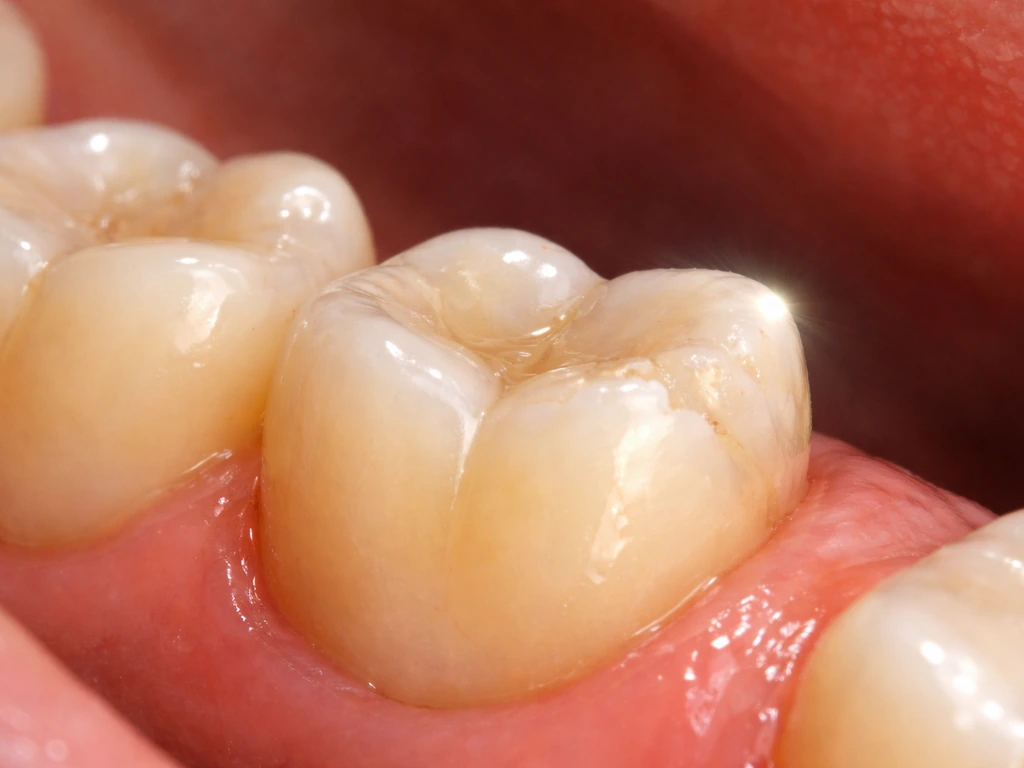 Close-up of a molar area with subtle healing, dramatic realistic lighting suggesting tooth regrowth